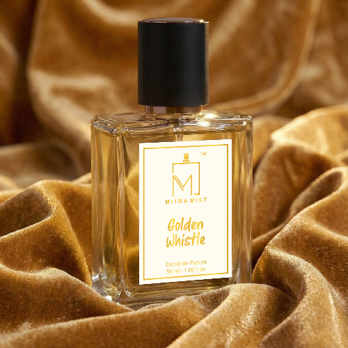 Perfume bottle labeled 'Golden Whistle' by Mitra Mist on a textured brown fabric background